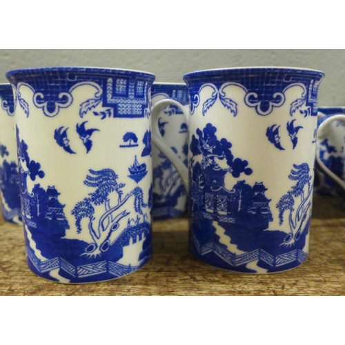 979 - Thirteen Leonardo Collection blue and white mugs, other blue and white vases, jugs, teapot, etc., Ri... 