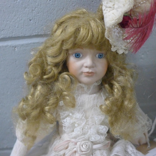 991 - A bisque head doll with wind up musical mechanism