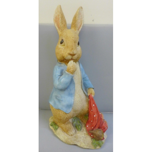 995 - A large model of Peter Rabbit, a collection of glass vases, brass jars, assorted figures including L... 