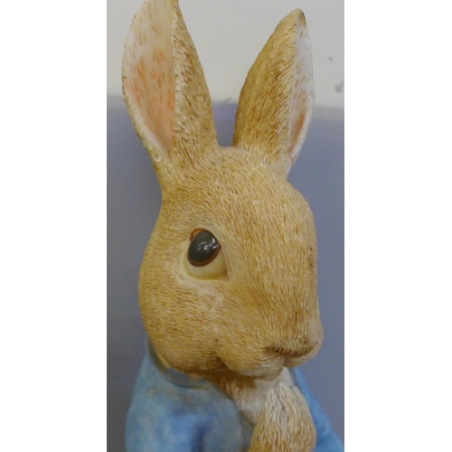 995 - A large model of Peter Rabbit, a collection of glass vases, brass jars, assorted figures including L... 