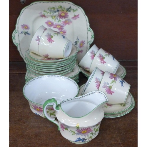 998 - An Aynsley hand painted floral part tea set, four cups a/f and Jeff Banks Porto of Call jug and pair... 