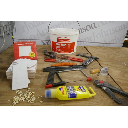 2347 - A 15kg tub of Unibond non-slip tile adhesive, a tub of tilers tools plus 33 150x150x4.5mm white cera... 