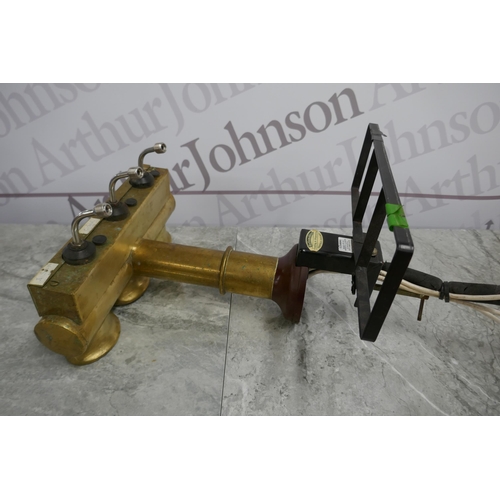 2380 - A brass beer pump with 3 taps and 2 bar mats