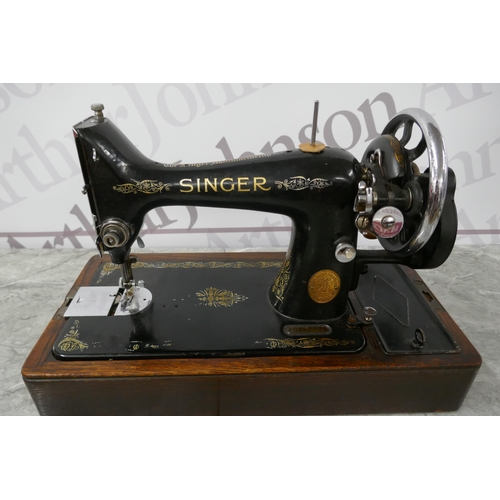 2390 - A vintage Singer EC182136 sewing machine with hard case, instructions and a box of sewing machine ac... 