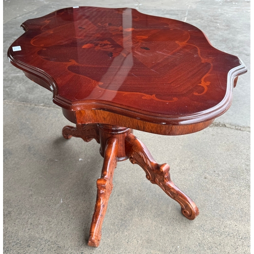 305 - An Italian Sorrento ware walnut effect coffee table