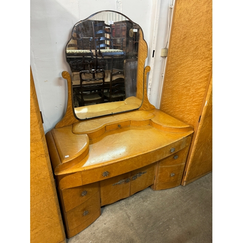 308 - An Art Deco birds eye maple bedroom suite, comprising; two wardrobes and a dressing table