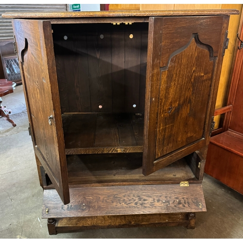 278 - A George III style Ipswich oak cupboard on stand