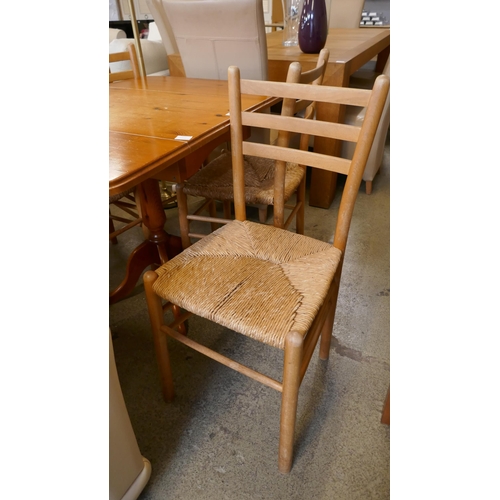 1598 - A pine dining table and four chairs