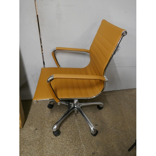 1400 - An Eames style tan faux leather office chair - RRP £149