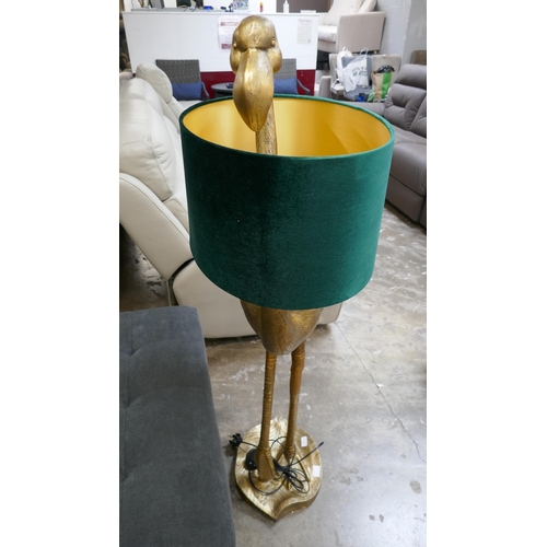 1434 - A gold floor standing lamp in the form of a flamingo