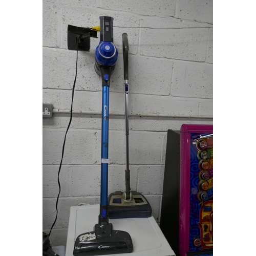 2153 - A Philips FC6125 electric sweeper and a Candy All Surface 10 cordless stick vacuum cleaner