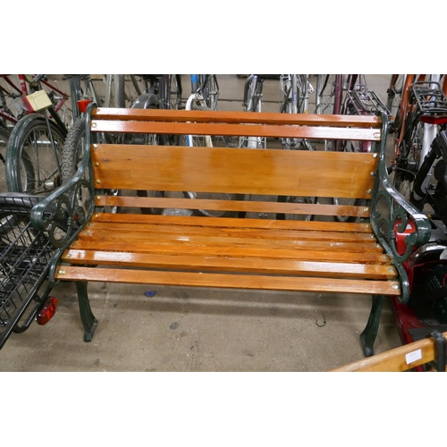 2160 - A 120cm wooden garden bench with cast iron bench ends