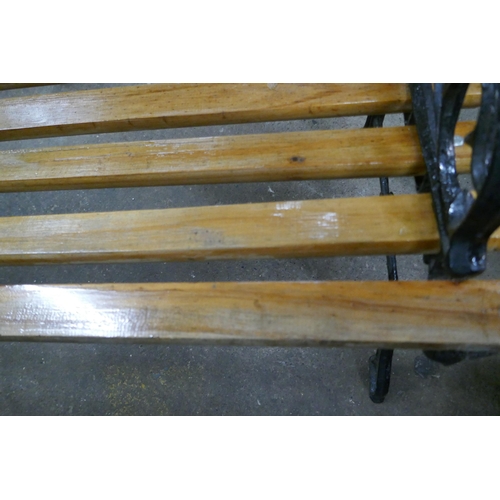 2161 - A 120cm wooden garden bench with cast iron bench ends