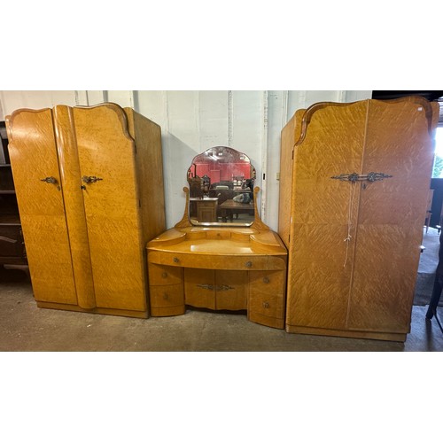 308 - An Art Deco birds eye maple bedroom suite, comprising; two wardrobes and a dressing table