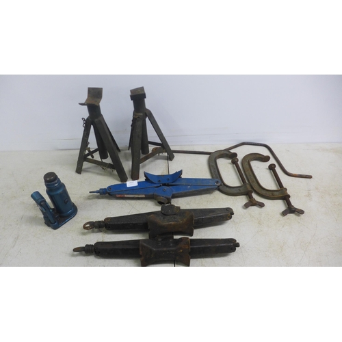 2037 - Three automotive roadside jacks, two record G-Clamps, a pair of axle stands and a 1 1/2 ton armstron... 