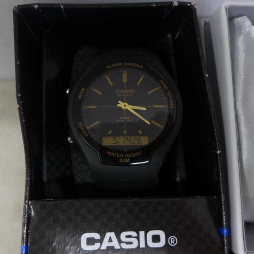 2096 - A men's Lorus black strap easy read dial watch, a Casio black diver's style wristwatch with black re... 