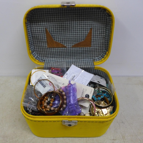 2103 - A jewellery case containing a large quantity of costume jewellery