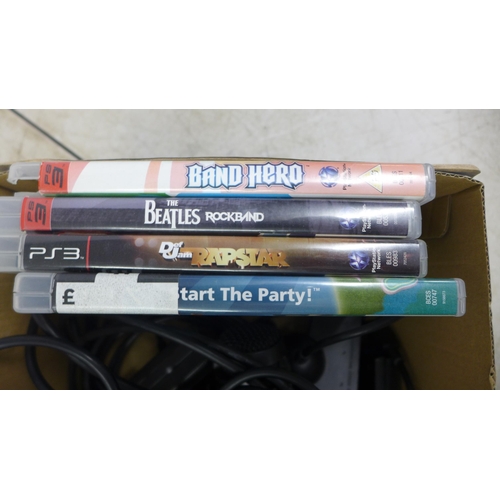 2104 - A PlayStation 3 console with 4 games including Band Hero, The Beatles Rockband, Def Jam Rapstar and ... 