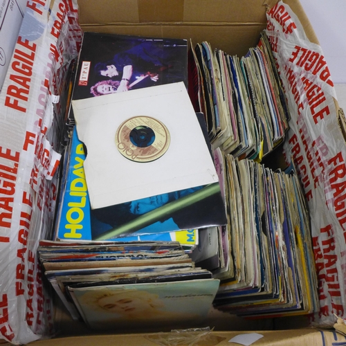 2141 - A box of approx. 100 1970s/80s singles and 10 tape cassettes