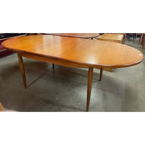 74 - A G-Plan Fresco teak oval extending dining table