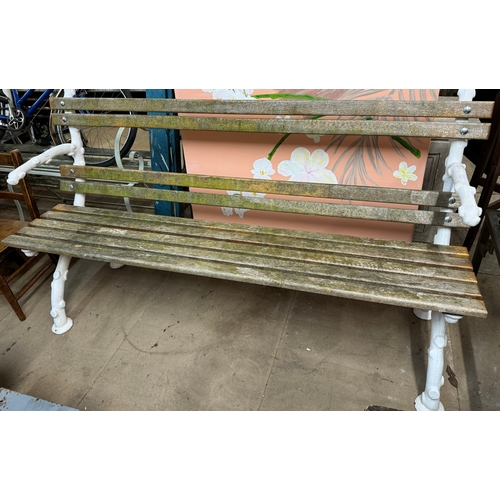 332 - A naturalistic cast iron ended garden bench