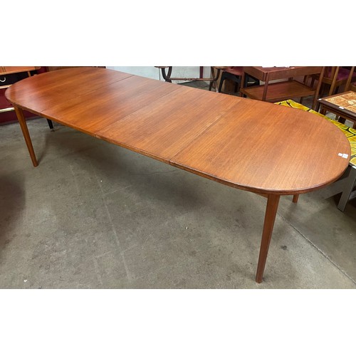 75 - A Swedish Troeds teak two leaf extending dining table