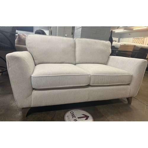 1425 - A White Fabric Two Seater Sofa