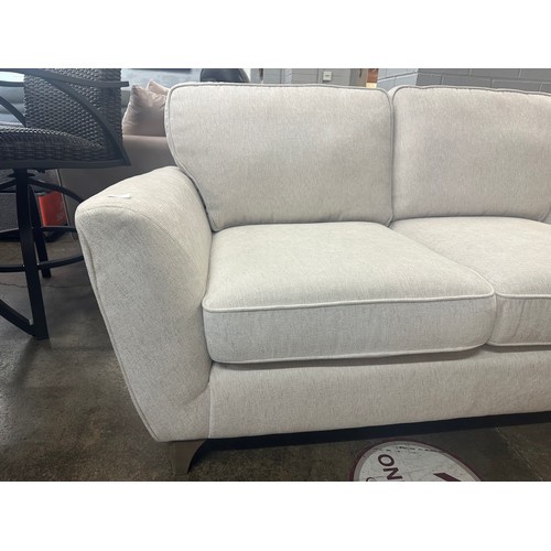 1425 - A White Fabric Two Seater Sofa