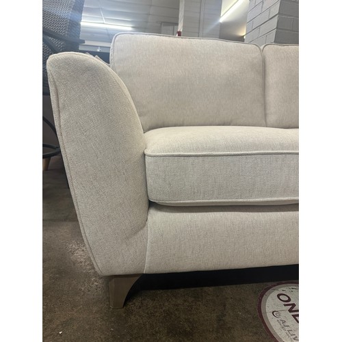 1425 - A White Fabric Two Seater Sofa