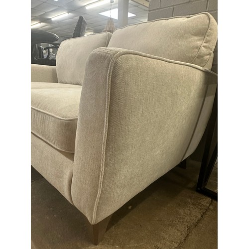 1425 - A White Fabric Two Seater Sofa