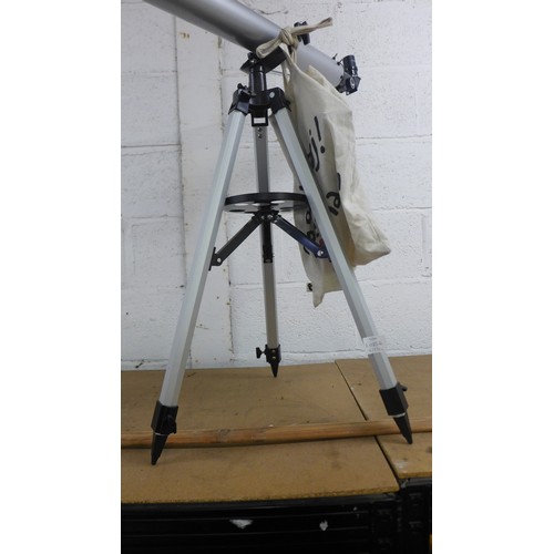 2085A - A Celestron #21041 D = 60mm, f = 800mm telescope with adjustable tripod stand and an assortment of a... 