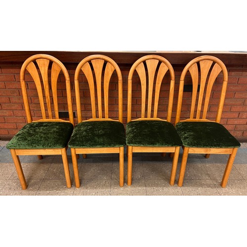 97A - A set of four teak dining chairs