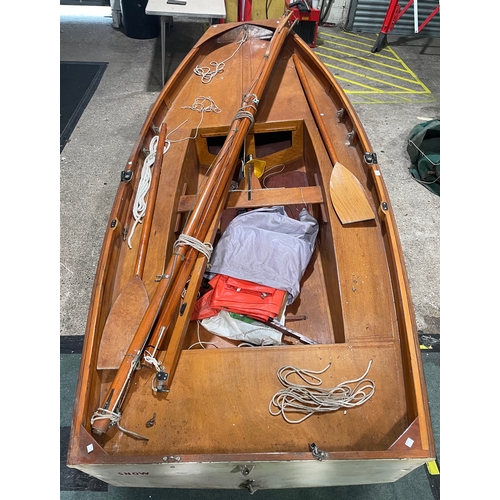 414 - A 10ft Mirror dingy sailing boat with mast, sail, oars, rudder and other accessories.