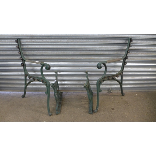 2215 - A pair of cast metal bench ends and table legs