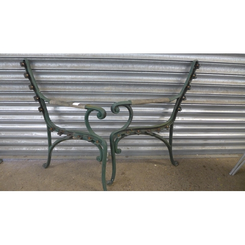 2215 - A pair of cast metal bench ends and table legs