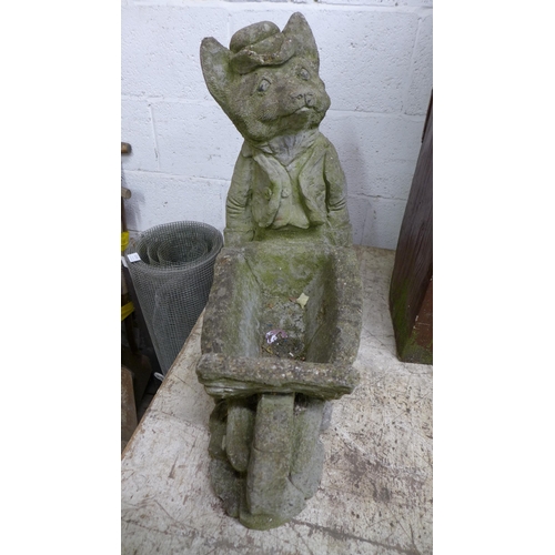 2232 - A quantity of stone garden figures including fox and barrow planter, water bucket planter and a wate... 