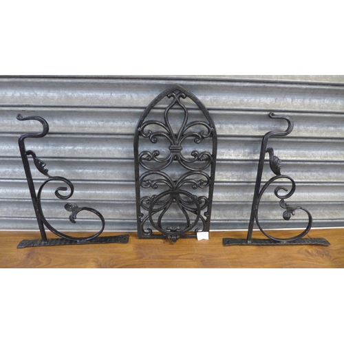 2243 - A selection of cast iron wall mounted planters, hanging baskets and wall brackets