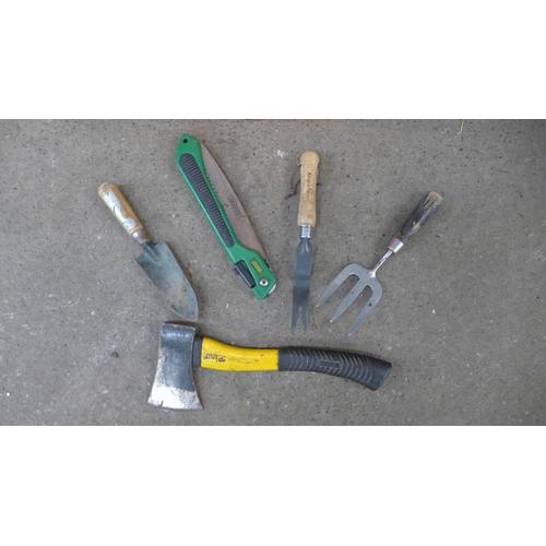 2245 - A quantity of garden tools including bow saw, rakes, brushes, a bucket, pitch fork, etc.