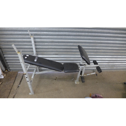 2266 - A Pro Fitness weightlifting bench with a quantity of plastic coated weights including six 5kg plates... 