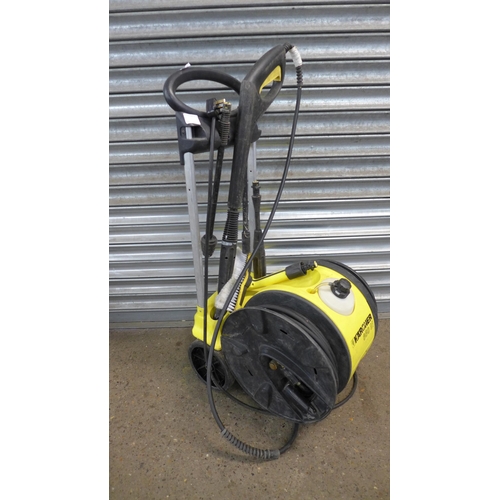 2269 - A Karcher 650M pressure washer with hose, lance and brush attachment