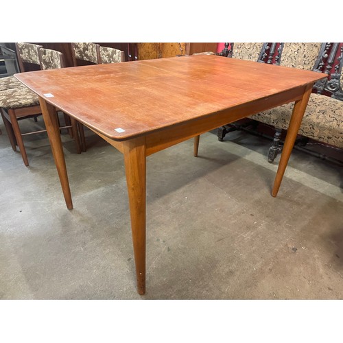 95 - A teak extending dining table