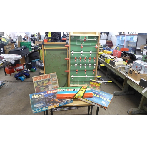 2324 - A quantity of vintage games including a wooden bagatelle board, table football, Escape from Colditz ... 