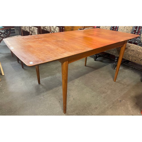 95 - A teak extending dining table