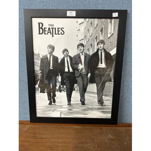 359 - A black and white Beatles print, framed