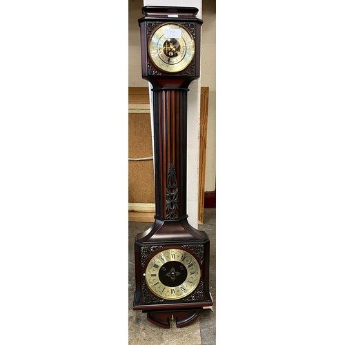 392 - A mahogany aneroid barometer/clock