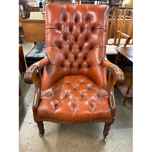 131 - A Regency style mahogany and red leather open armchair