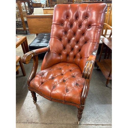 131 - A Regency style mahogany and red leather open armchair