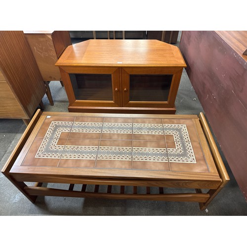 117 - A teak and tiled top coffee table and a teak TV stand