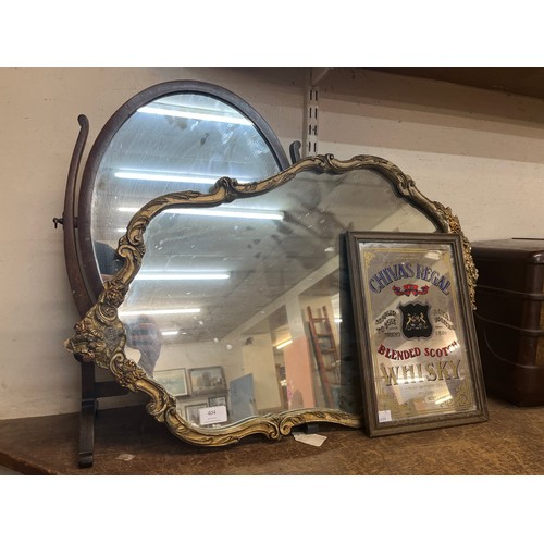 404 - A gilt framed mirror, toilet mirror and Chivas Regal pub mirror