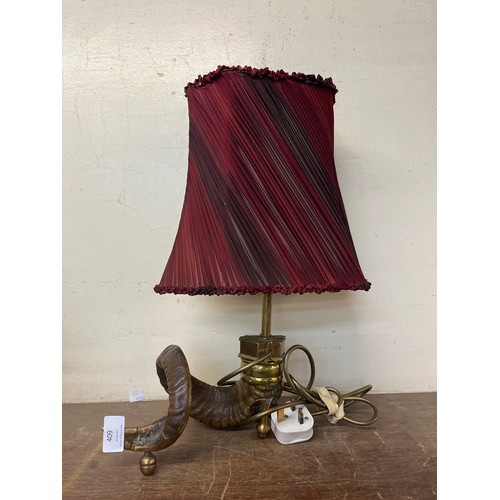 409 - A brass mounted ram's horn table lamp